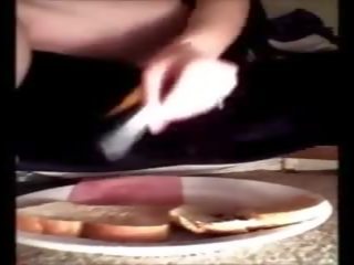 Charming Brunete cookie Making Tasty Jam Sandwich for.